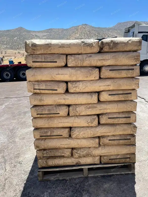 Multi-wall kraft bags of asphaltic mud additive