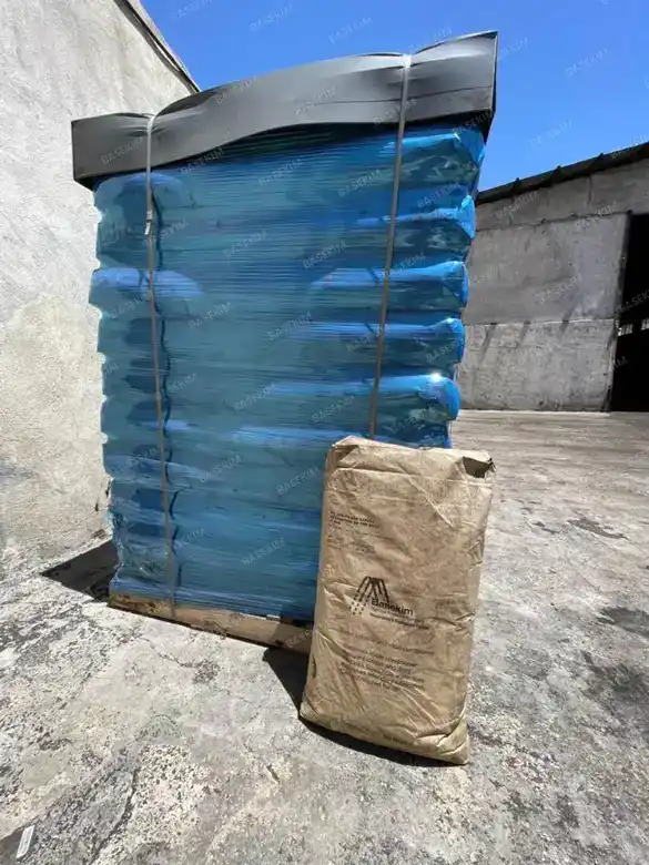 Gilsonite pallets stretch-wrapped in blue film