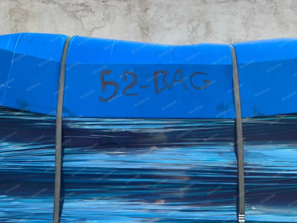 Gilsonite pallets stretch-wrapped in blue film