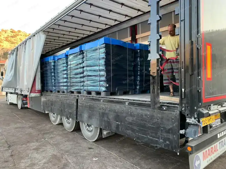 Flatbed truck loaded with gilsonite pallets