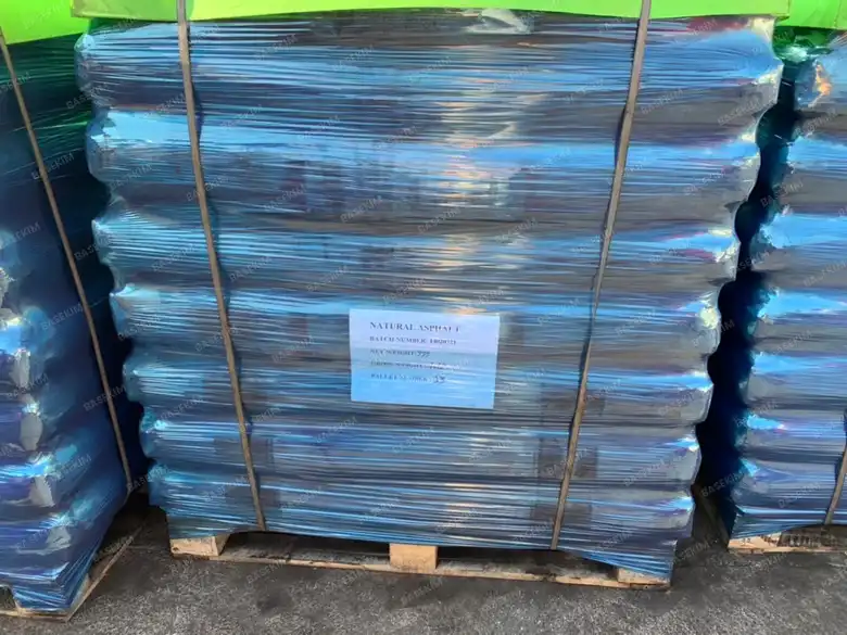 Rows of palletized gilsonite in the loading yard