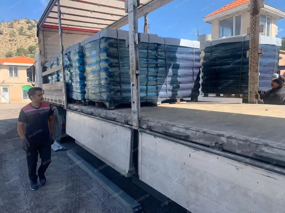 Trailer of palletized gilsonite leaving the plant