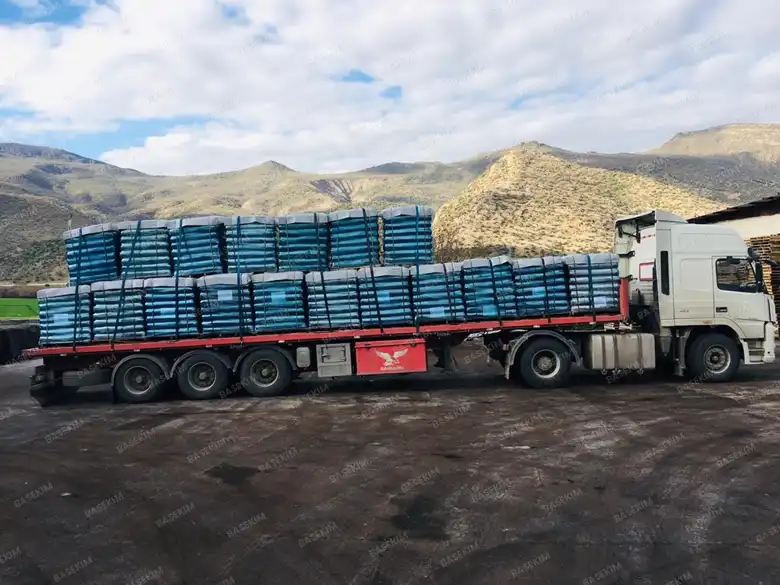 Flatbed truck loaded with gilsonite pallets