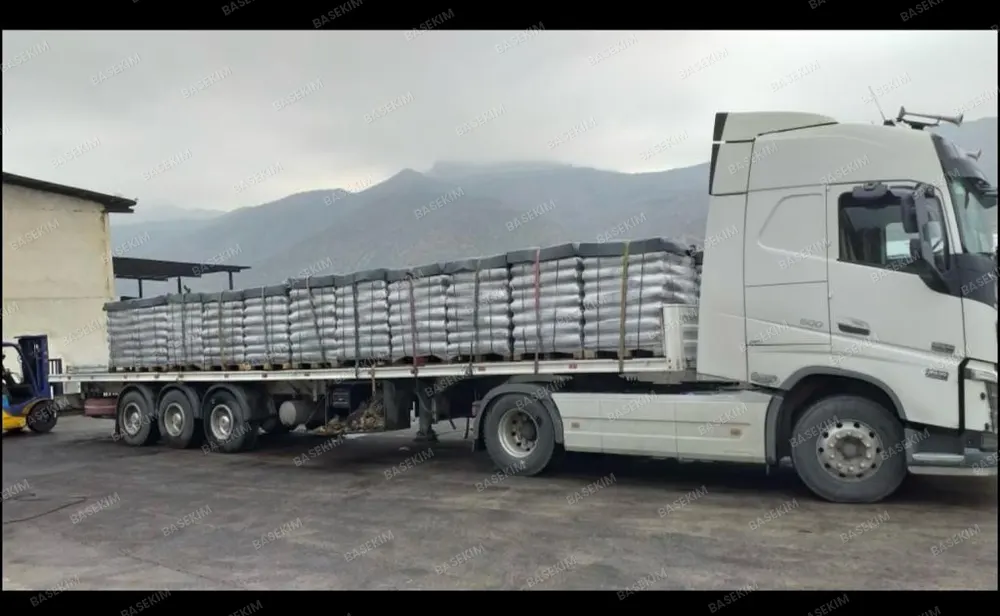 Gilsonite shipment strapped on a trailer – paving application
