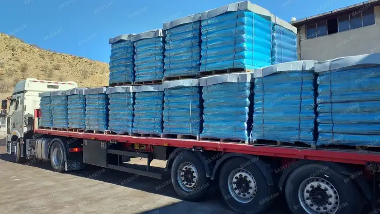 Trailer of palletized gilsonite leaving the plant