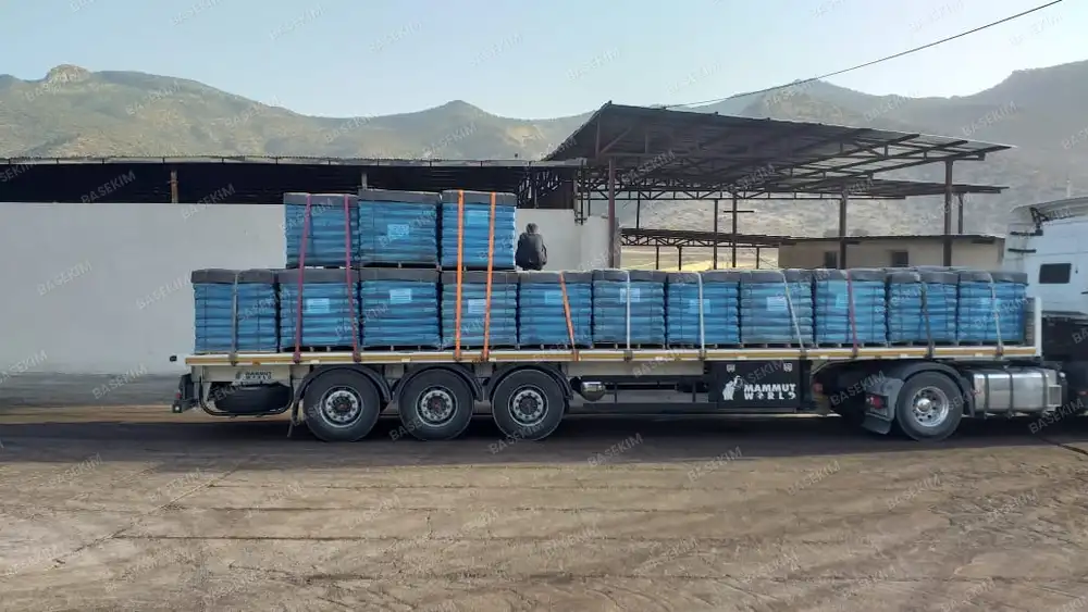 Flatbed truck loaded with gilsonite pallets