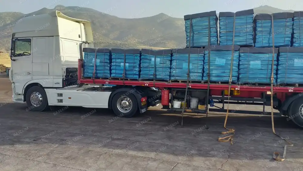Gilsonite shipment strapped on a trailer